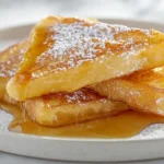 Cracker Barrel French toast served with powdered sugar and syrup